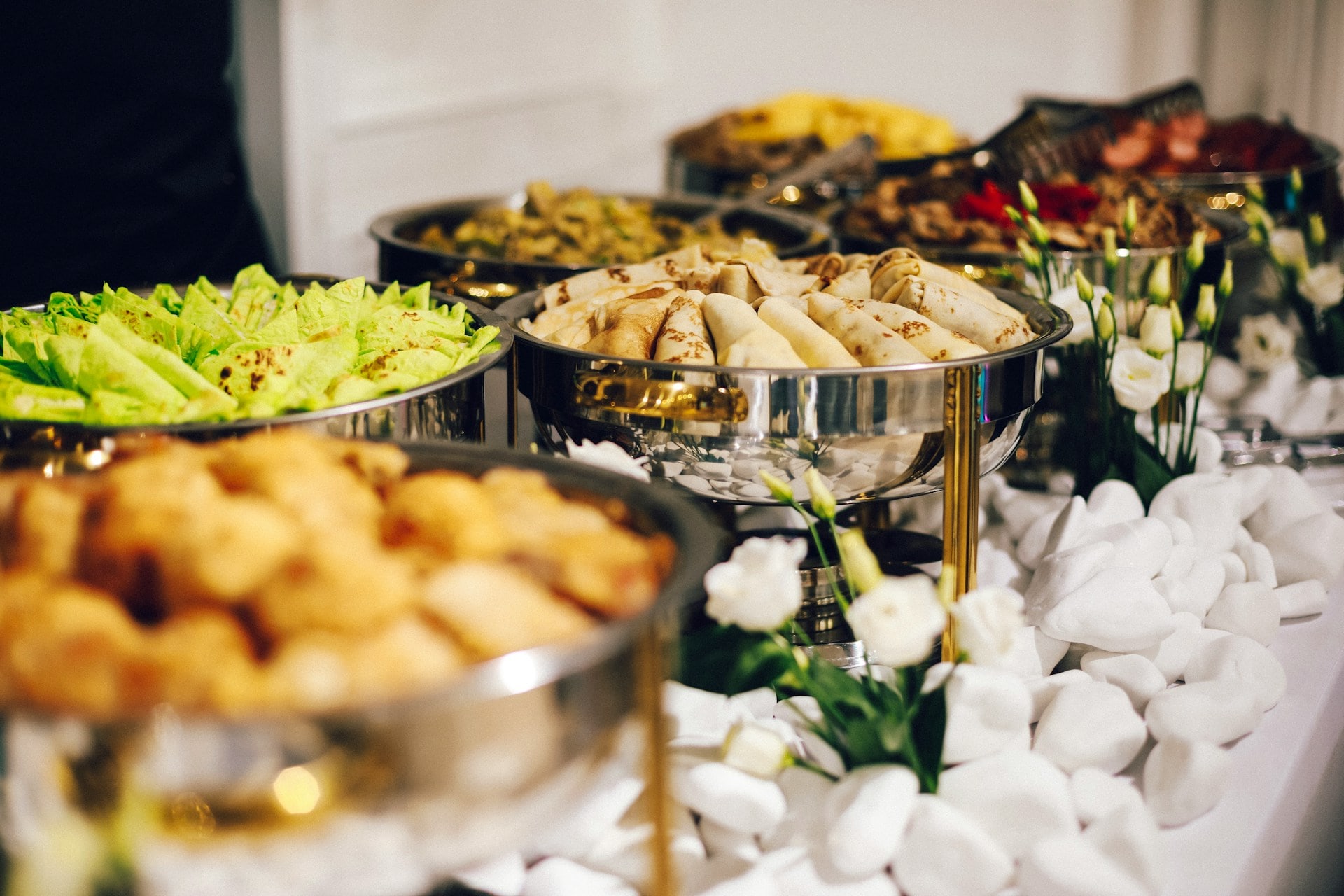 Festive buffet with colourful bites, platters and flowers